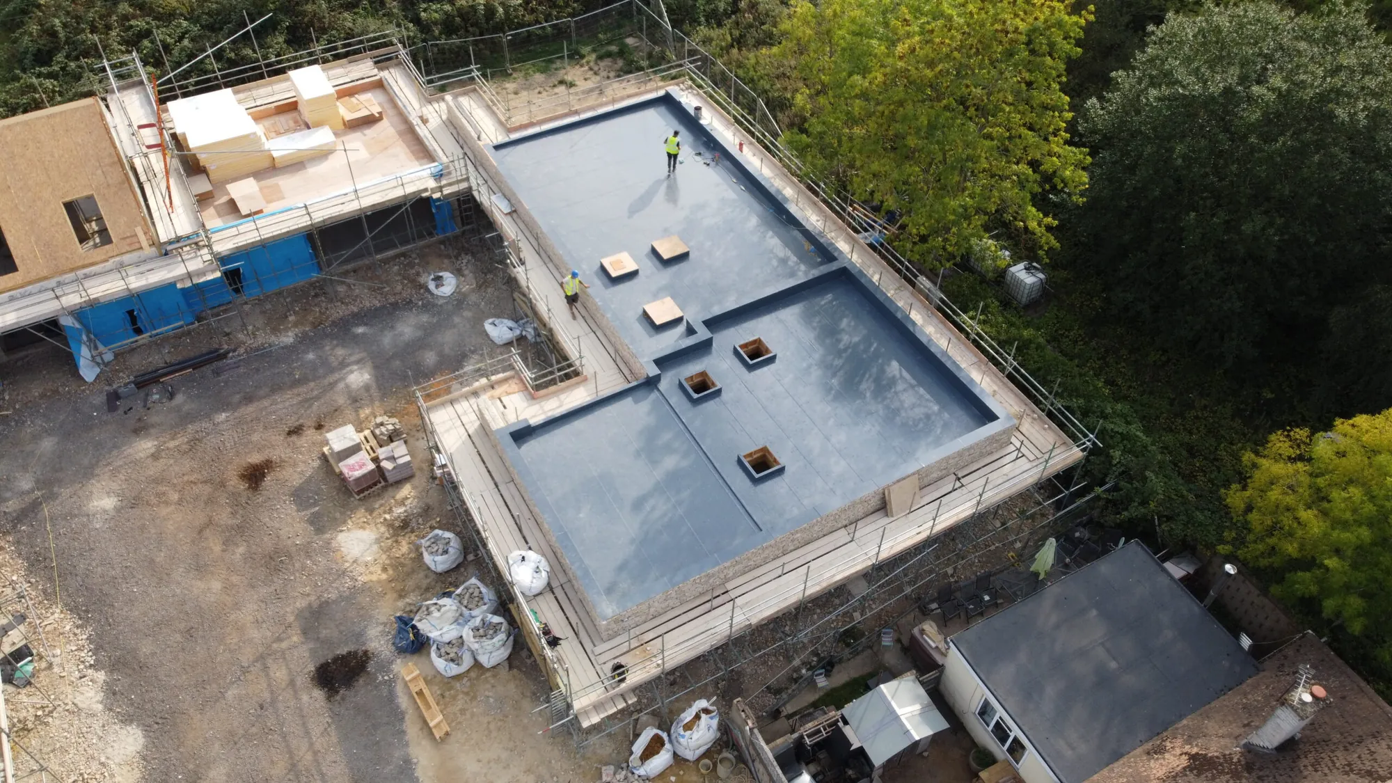 Aerial view of The Flat Roofing Company team on a completed flat roof